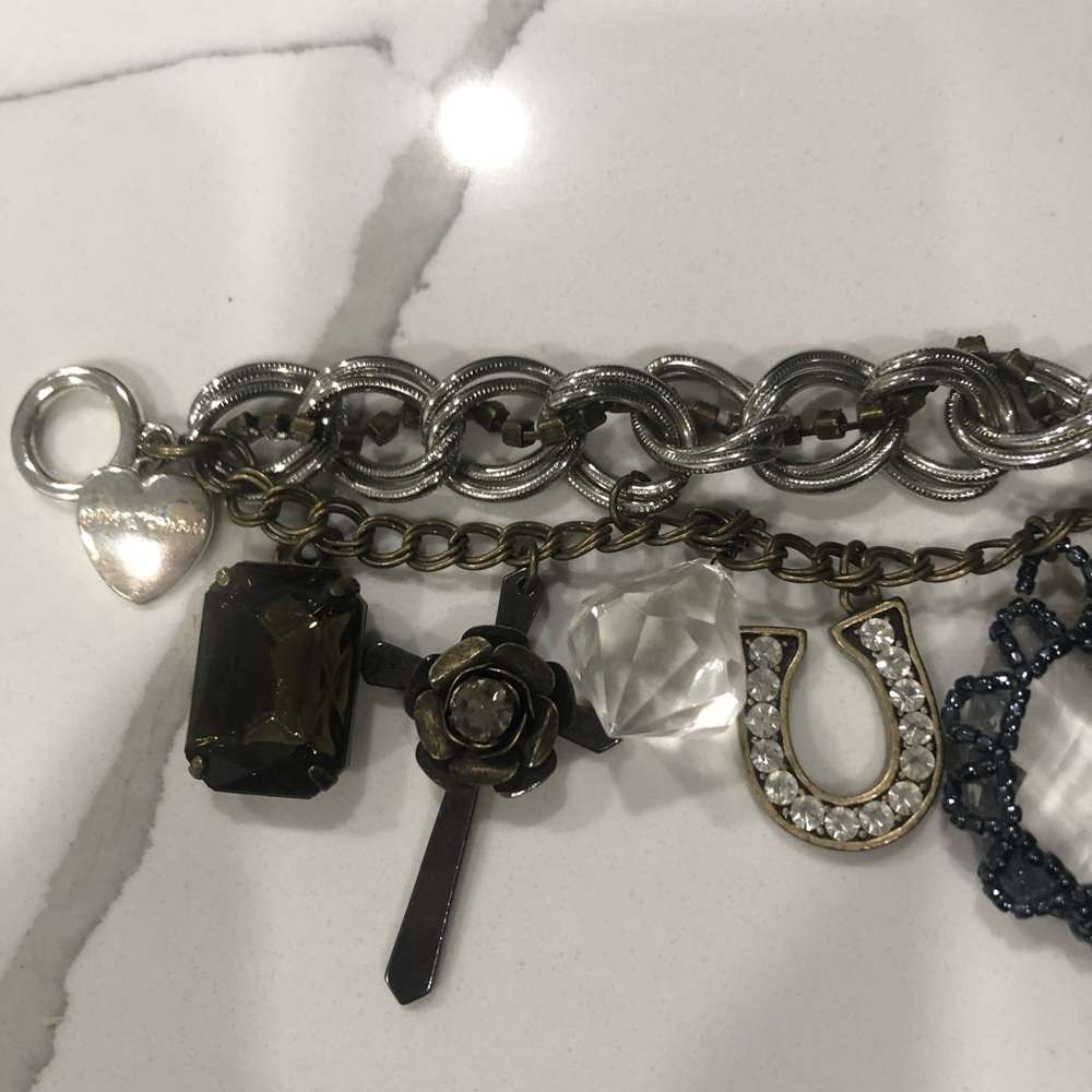 Beautiful charm bracelet by besty Johnson it is 8inches long hardly worn
